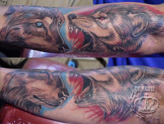 Fighting wolf tattoo